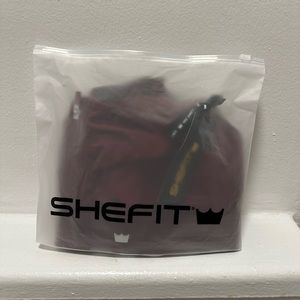 Brand new never worn wine colored Shefit Ultimate sports bra size 1 luxe.